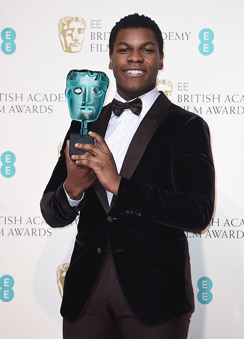 John Boyega chose to wear a custom Giorgio Armani chocolate brown two-button shawl collar tuxedo matched with a chocolate brown bow tie (Credit: Ian Gavan)